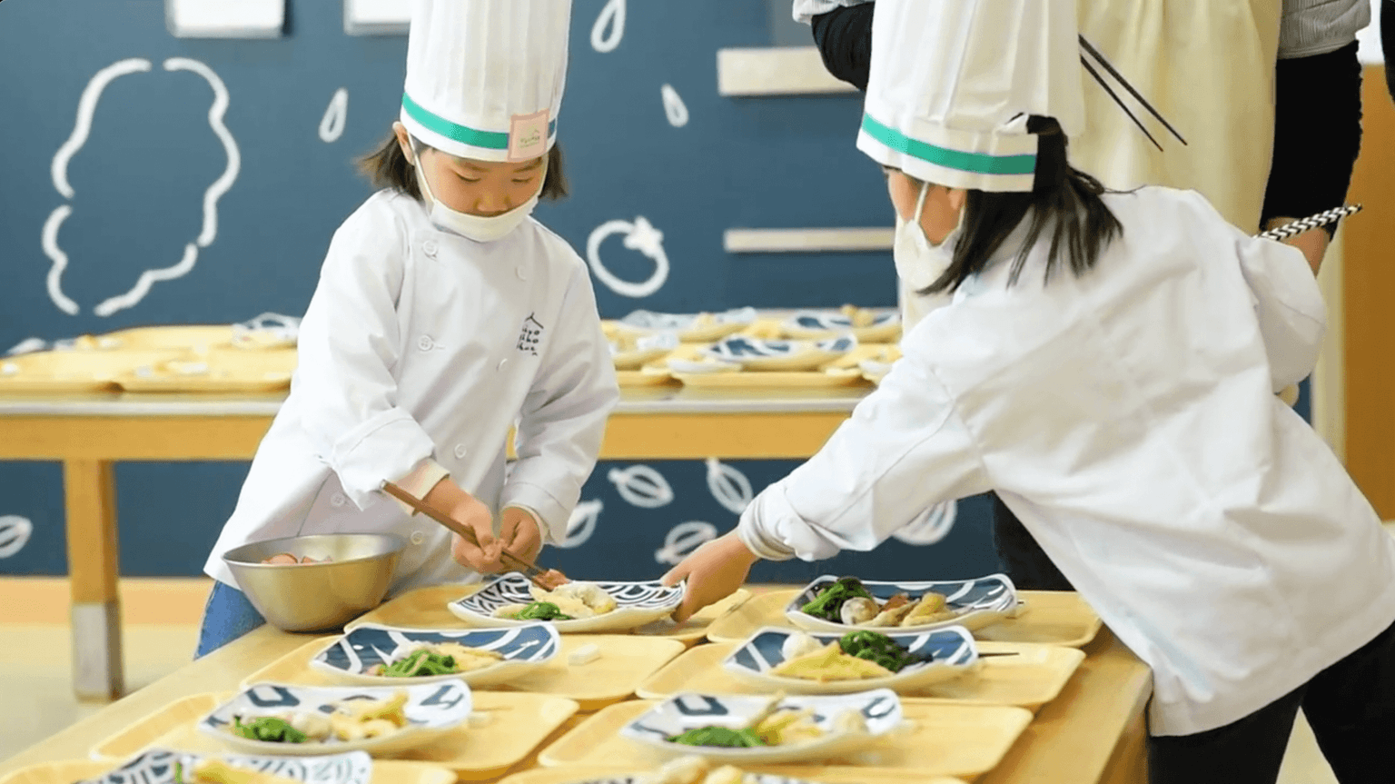 Nursery school children prepare food with real knives